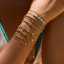Pulsera de tenis de circonita chapada en oro, apilable, con diseño de luna y estrella, y doble capa. thumbnail 2