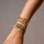 Pulsera de tenis de circonita chapada en oro, apilable, con diseño de luna y estrella, y doble capa. thumbnail 3